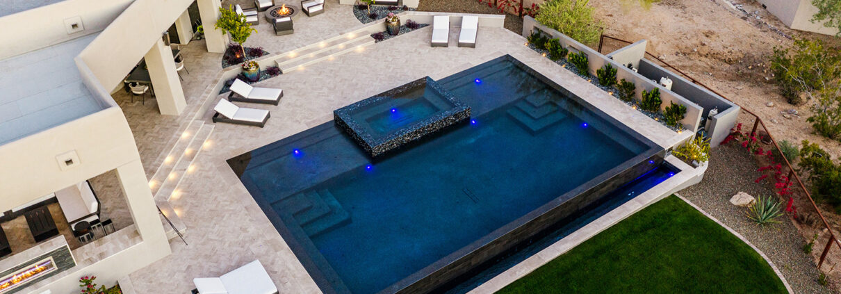 Luxury pool builder in Scottsdale designing custom backyard pool and spa